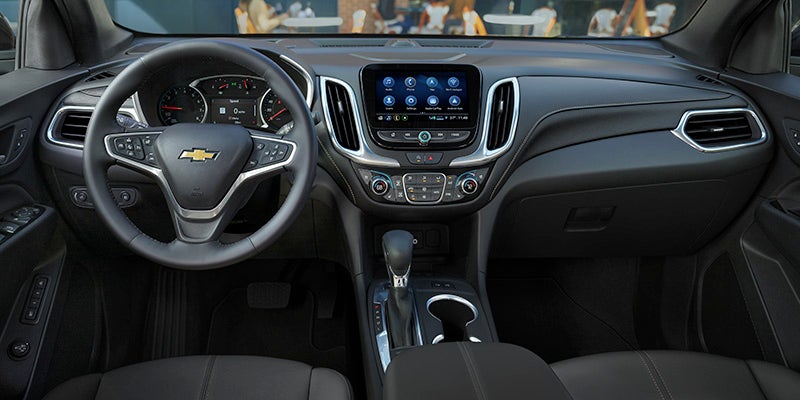 interior of the 2024 chevy equinox front seats view the dashboard and steering wheel