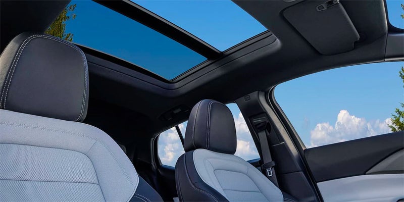interior view of black and white leather seats and sun roof of a 2024 chevy equinox ev
