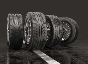 Four car tires rolling on a road on a gray background. 3d illustration | Vancouver, WA